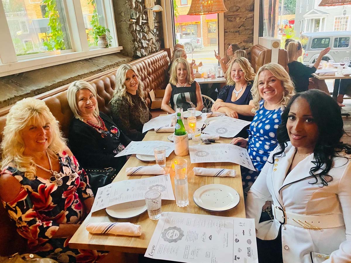 Amour Women members gathered at a restaurant
